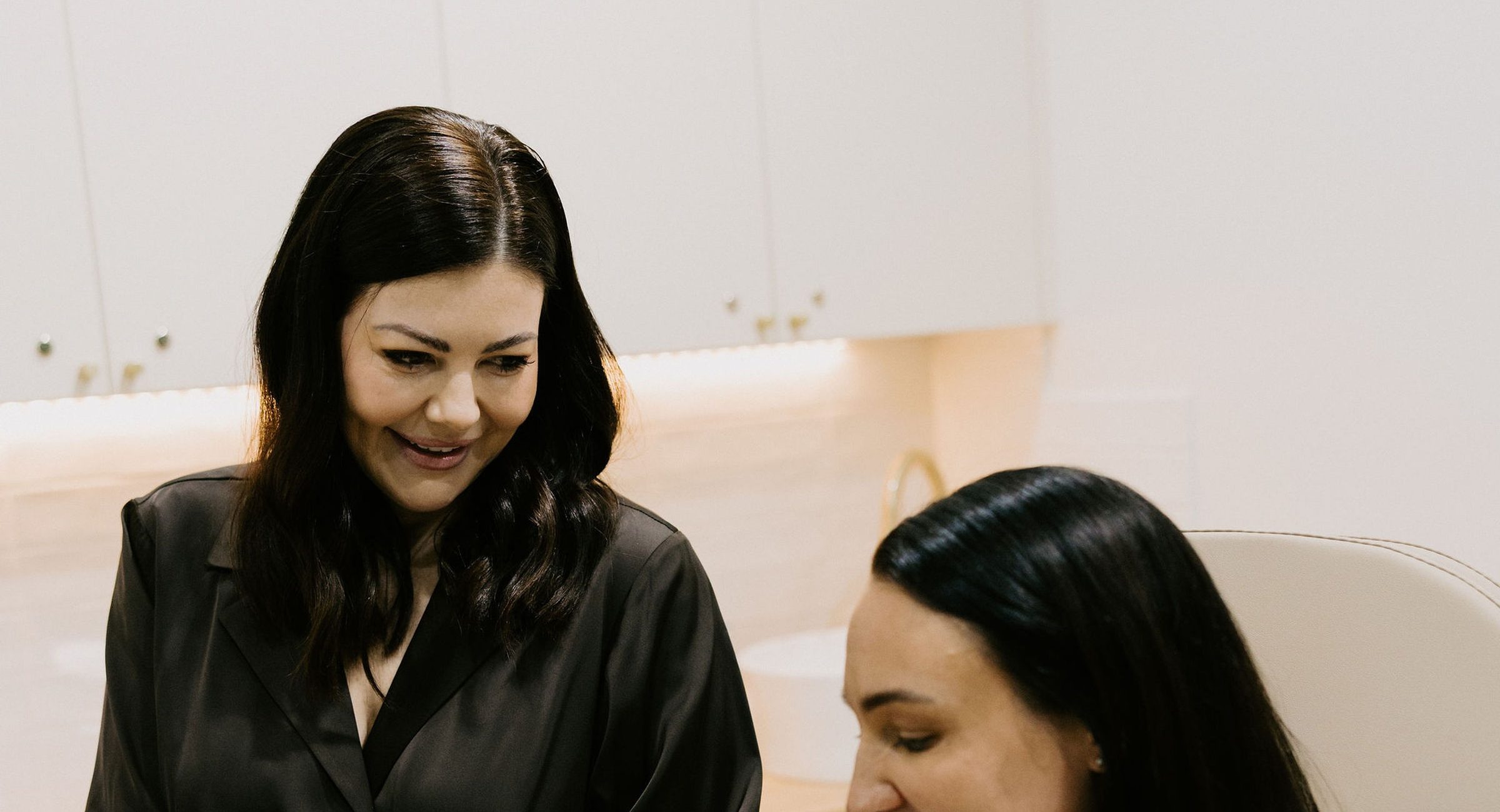 Sarah Munnings, registered nurse and founder of Bloom Aesthetic Clinic, with a patient.