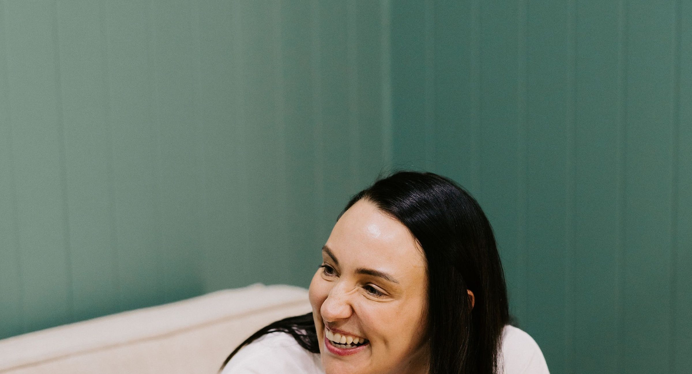 A patient smiling during a consultation at Bloom Aesthetic Clinic, Bellerive.